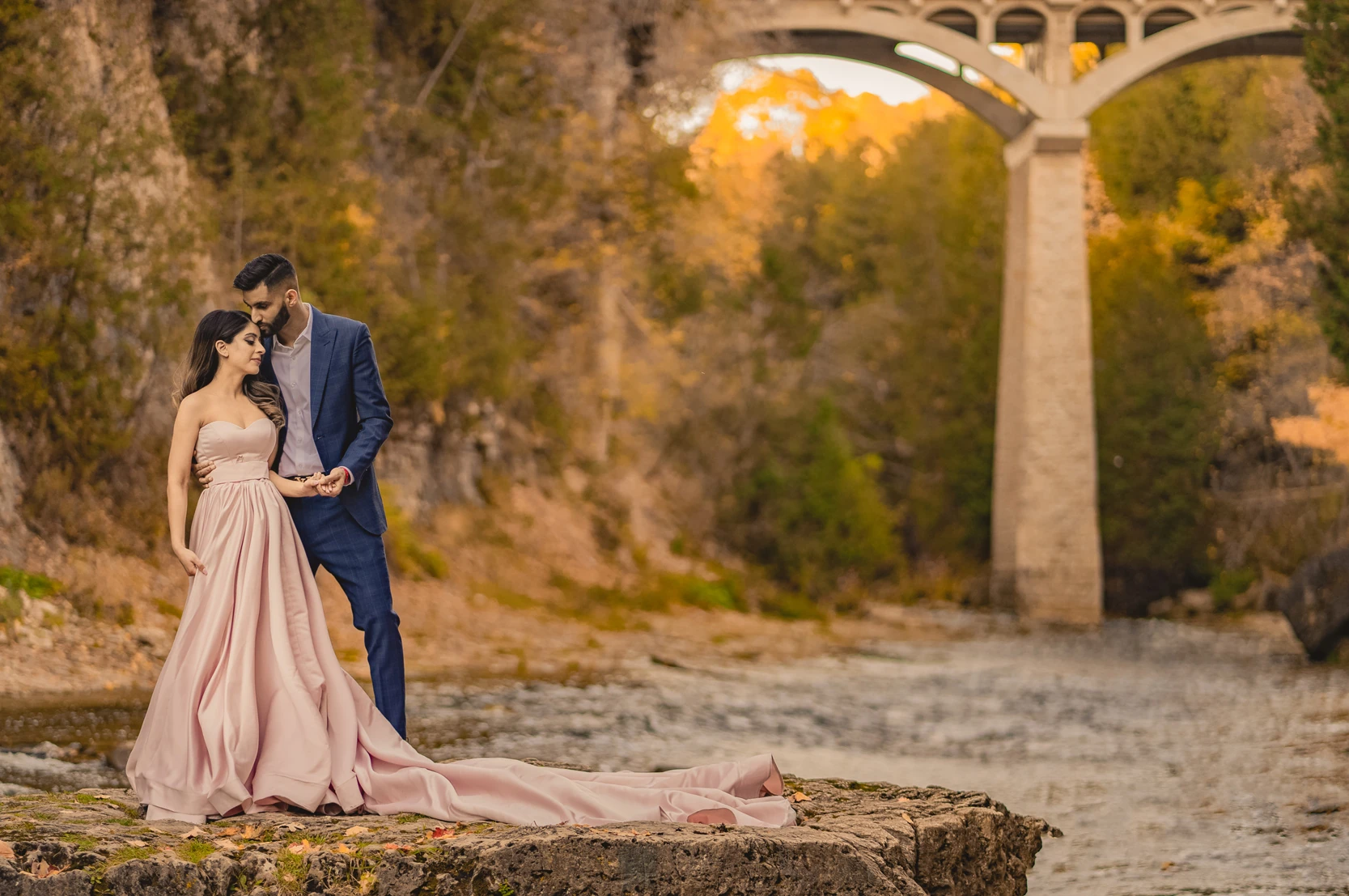 Fall Engagement Photos of a couple in a blush pink dress